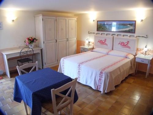 Ένα ή περισσότερα κρεβάτια σε δωμάτιο στο LE NEREIDI Hotel & Residence