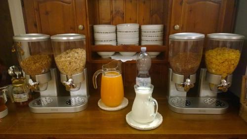 a counter with three blenders with different types of food at Garnì Defrancesco in Campitello di Fassa
