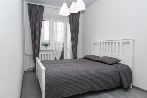 
Кровать или кровати в номере Счастливая квартира на Широтной
