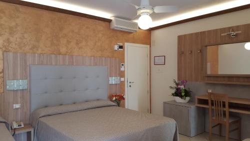 Кровать или кровати в номере Hotel Ambra
