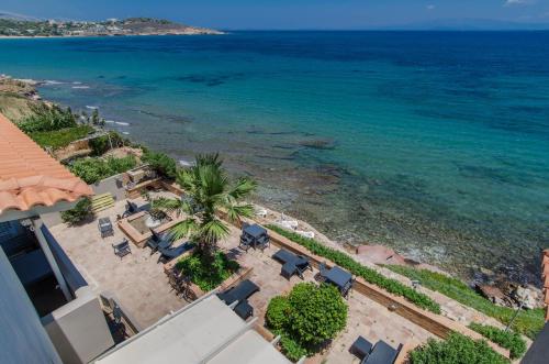 an aerial view of the beach and the ocean at Plaka Studios in Karfas