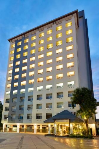 a large white building with a gazebo in front of it at Ruenthip Pattaya in Pattaya North