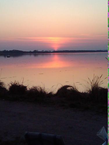 a sunset over a body of water at Thorup Guesthouse in Knebel