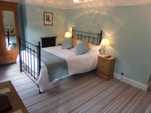 A bed or beds in a room at Broomfield House 