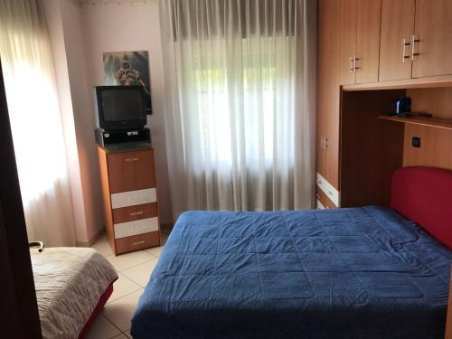 Ένα ή περισσότερα κρεβάτια σε δωμάτιο στο Villa Vacanze