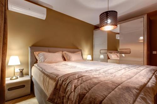 Voodi või voodid majutusasutuse Silver & Gold Apartment toas