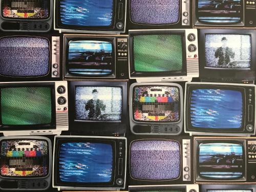 a bunch of cell phones lined up in a wall at Albert's Rest in Ramsgate
