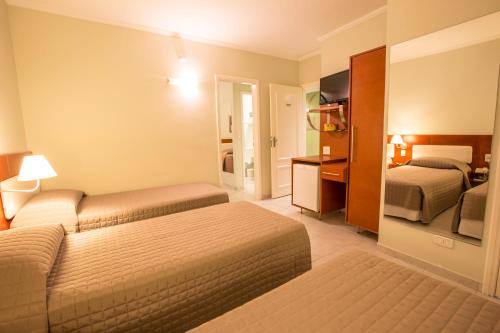 เตียงในห้องที่ Hotel Ipanema de Sorocaba