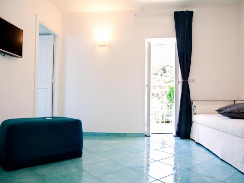 a room with a bed and a suitcase on the floor at Antonio Massa Lubrense in Massa Lubrense