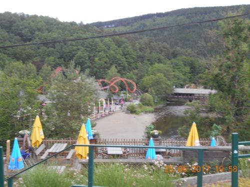a view of an amusement park with a roller coaster at Le Vieux Sart 3 in Stavelot