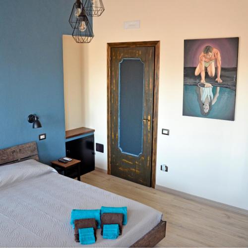 Katil atau katil-katil dalam bilik di Artista B&B