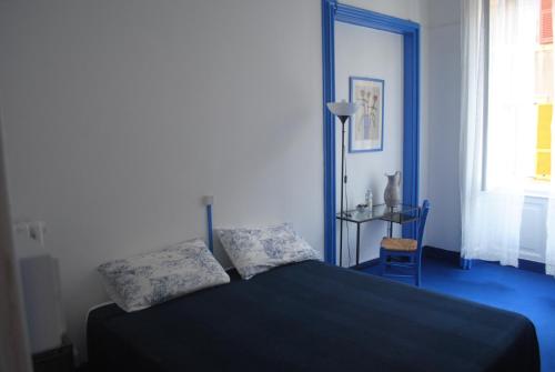 Ένα ή περισσότερα κρεβάτια σε δωμάτιο στο Olympia Hotel