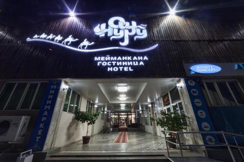 a sign on the front of a hospital building at Hotel Osh-Nuru in Osh