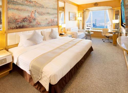 a large bedroom with a large bed in a room at Regal Hongkong Hotel in Hong Kong