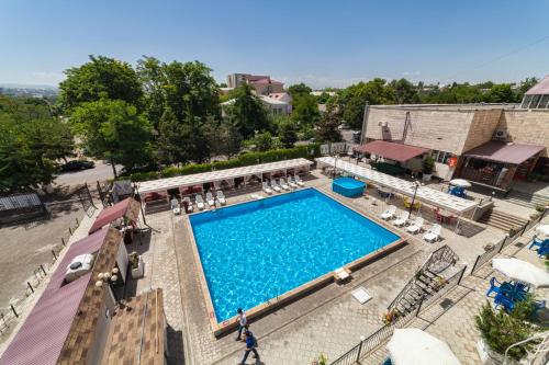 an overhead view of a swimming pool at a resort at Hotel Osh-Nuru in Osh