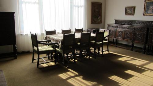 a dining room with a table and chairs at Dili Villa in Dilijan
