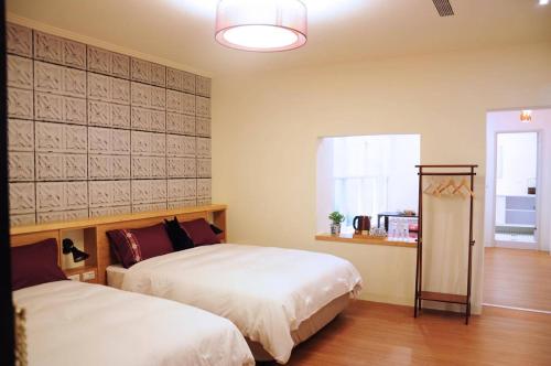 A bed or beds in a room at 爪窩 29 Nesuto