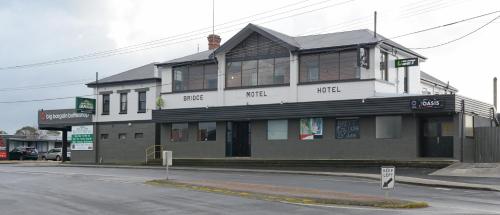 a large building with a large window on the side of it at Bridge Hotel in Smithton