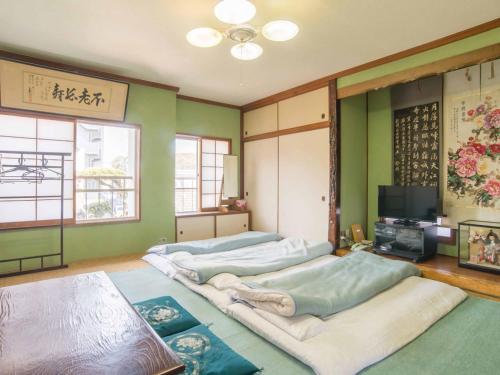 Ліжко або ліжка в номері Kenrokuen
