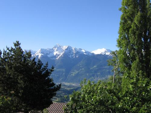 a view of snow capped mountains from a house at Breckenbreck monolocale CIN IT7001C2P4NVWOPA in Allein