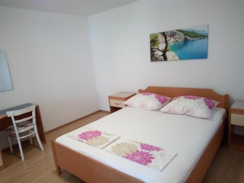 Postel nebo postele na pokoji v ubytování Apartmani Mileta