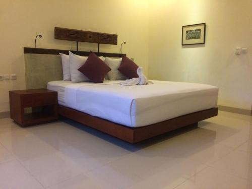 Letto o letti in una camera di Ubud Bungalow