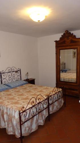 Una cama o camas en una habitación de Residence Casprini da Omero