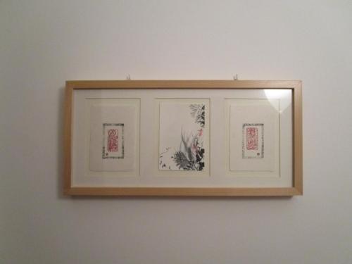 a mirror on a wall with three pictures on it at Casa Balducci Bed&Breakfast in Mercatello sul Metauro