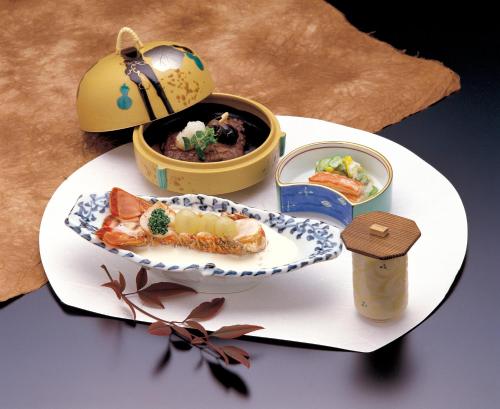 a plate of food on a table with a plate of food at Maruei in Fujikawaguchiko