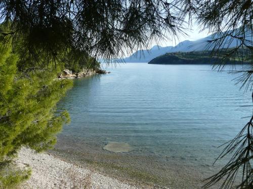 a view of a lake with mountains in the distance at Villa Irini in Ancient Epidavros