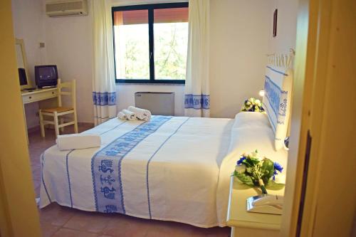 Postel nebo postele na pokoji v ubytování Hotel Montiruju