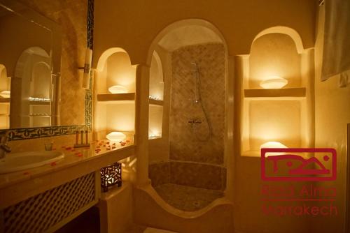 a bathroom with a shower and a sink at Riad Alma in Marrakech