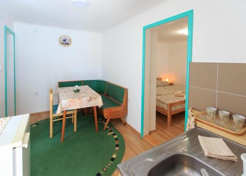 Postel nebo postele na pokoji v ubytování Fortuna Apartments
