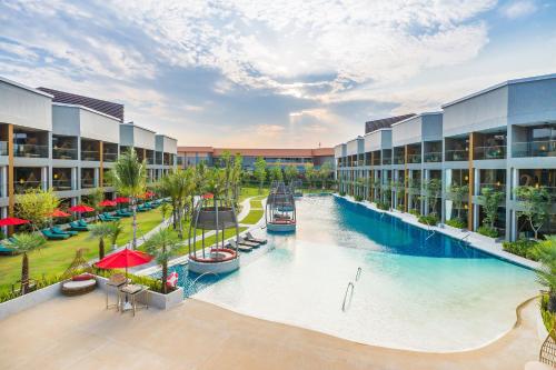 an aerial view of a resort with a large swimming pool at Avani+ Hua Hin Resort in Cha Am