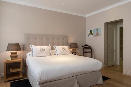 Postel nebo postele na pokoji v ubytování Hotel Le Dixseptième