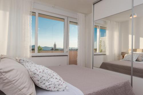 Posteľ alebo postele v izbe v ubytovaní Amazing View Apartment