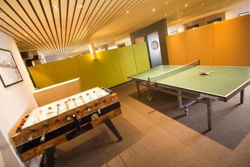 a ping pong room with a ping pong table at Wohlfühlhotel Hubertushof in Stuben am Arlberg
