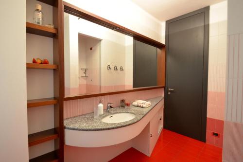 a bathroom with a sink and a mirror at Villa Onorina in Carimate