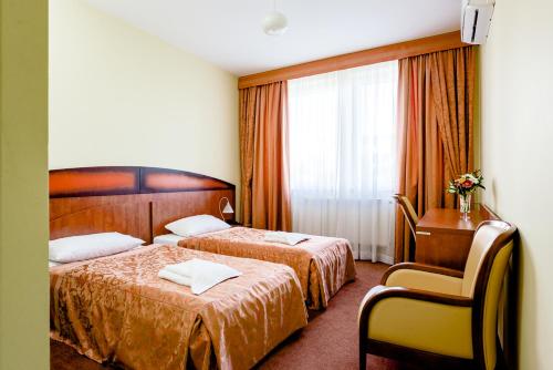 Ένα ή περισσότερα κρεβάτια σε δωμάτιο στο Hotel Stal