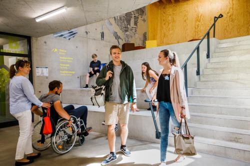 a group of people standing around in a building at Jugendherberge Bayreuth in Bayreuth