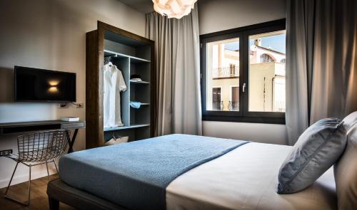 Cama o camas de una habitación en Teku Sardinia Boutique Hotel