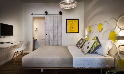 Cama o camas de una habitación en Teku Sardinia Boutique Hotel