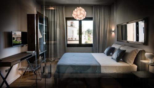 Cama o camas de una habitación en Teku Sardinia Boutique Hotel