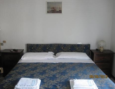 a bedroom with a bed with two towels on it at Verde Mare in Silvi Marina