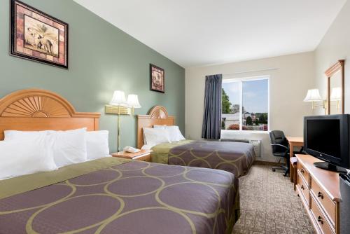 Ένα ή περισσότερα κρεβάτια σε δωμάτιο στο Knights Inn Palmyra