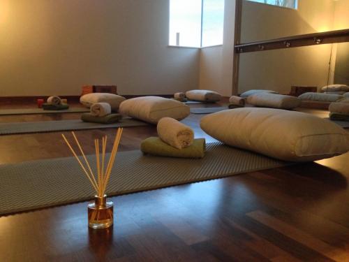 a room with a bunch of pillows on the floor at Ockenden Manor Hotel & Spa in Cuckfield