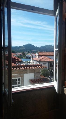 a view of a city from a window at casa cardeal saraiva in Ponte de Lima