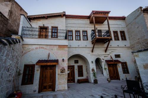 an old building with a balcony on top of it at Yoruk Stone House in Nevsehir