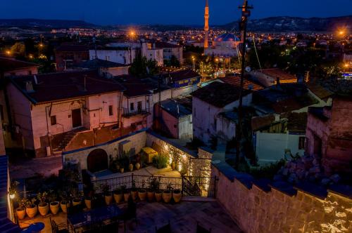 a view of a city at night at Yoruk Stone House in Nevsehir