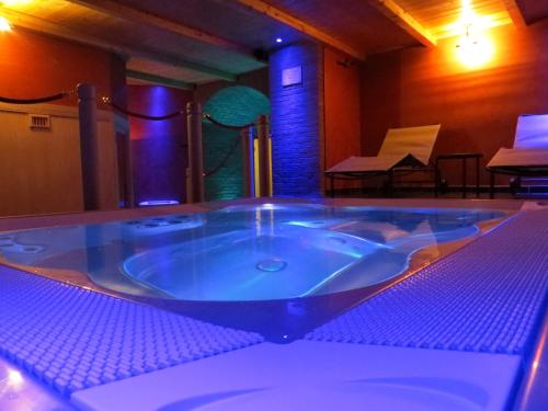 a large jacuzzi tub in a room with a piano at Agriturismo Casale delle Lucrezie in Todi
